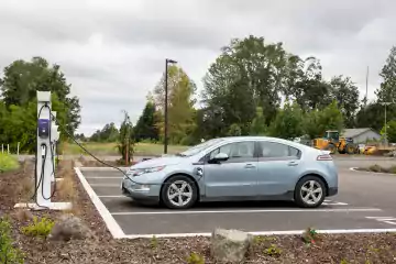 plugged electric car getting charged